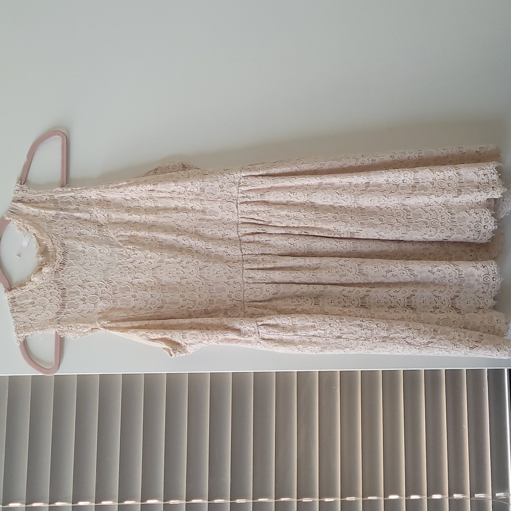 High necked open back lace dress
